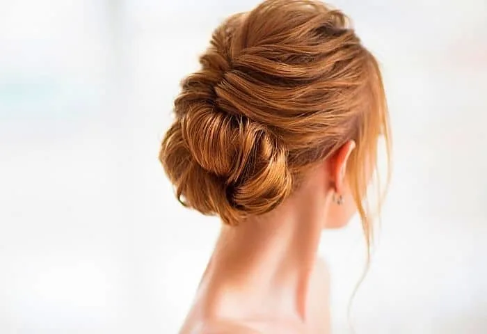 Try a different hairstyle to look more feminine without makeup