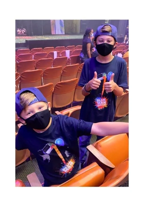 Wear merch tee to blue man group