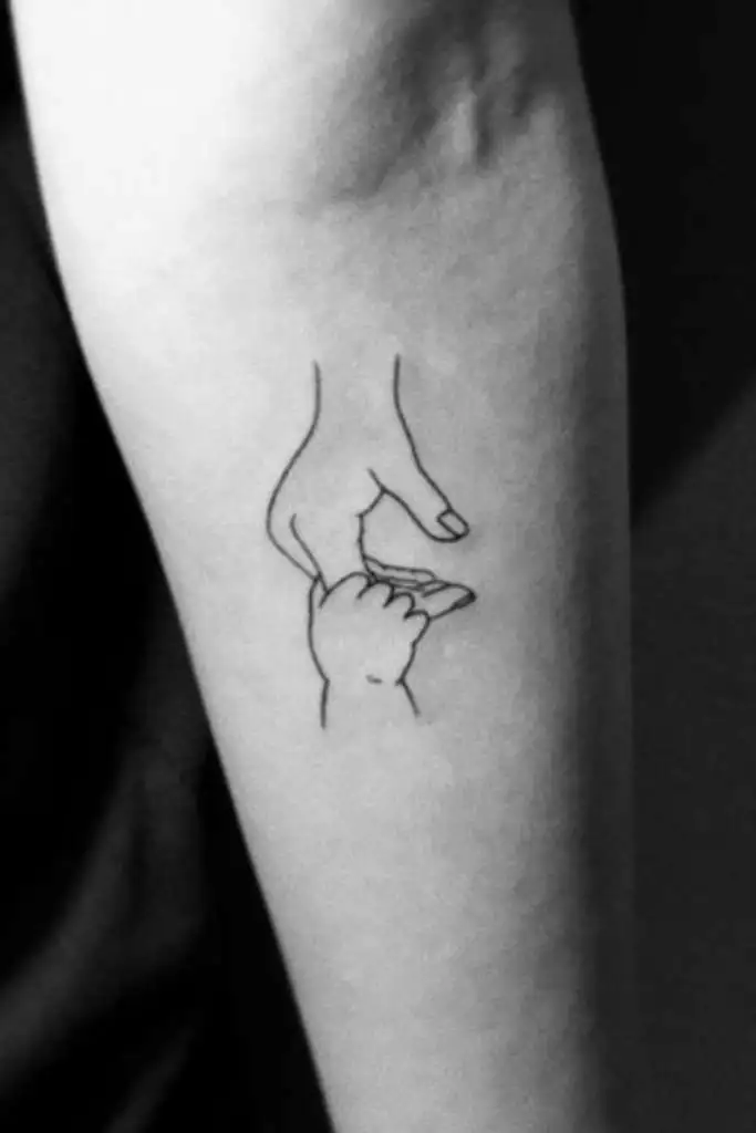 Mom and baby tattoo designs on wrist