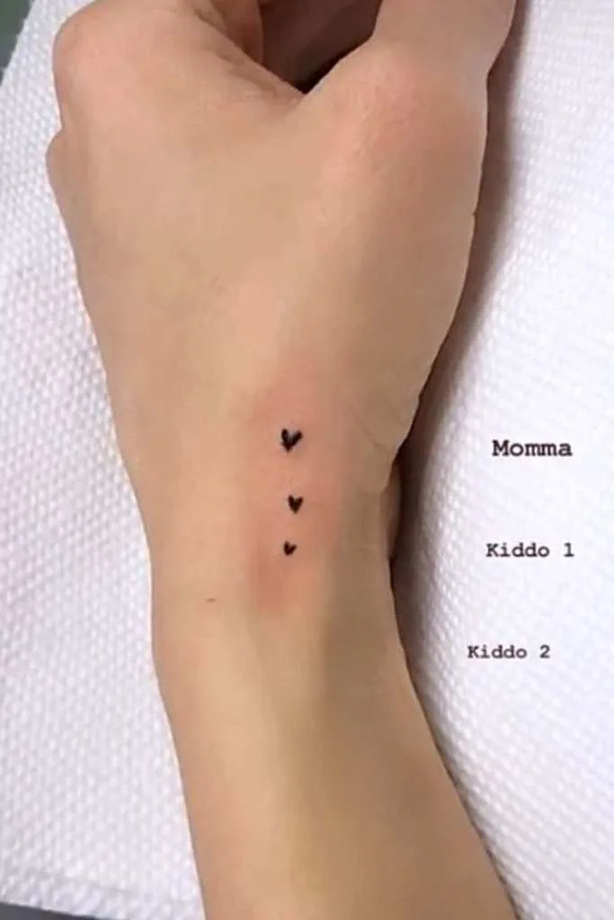 Micro heart family tattoo 