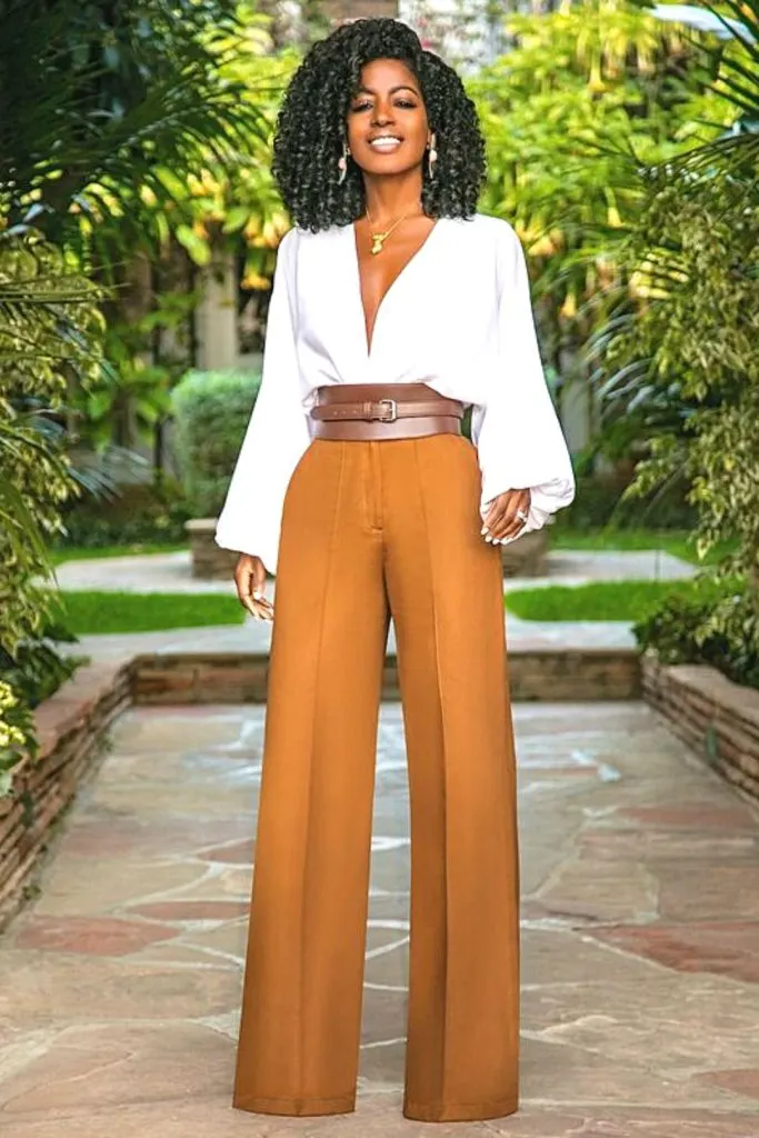 palazzo pants and corset belt wedding guest outfit ideas with pants