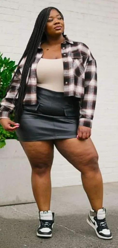 leather mini skirt and sneakers