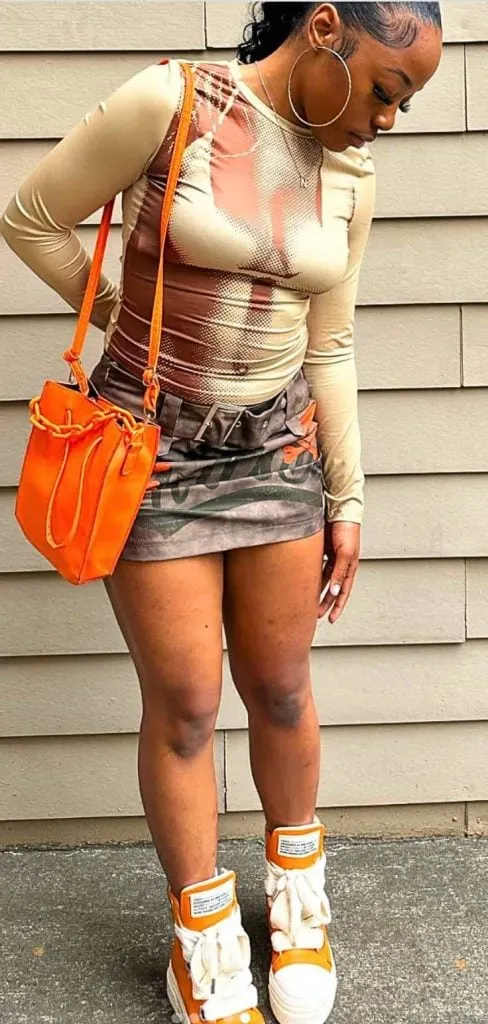 baddie mini skirt and sneakers outfit