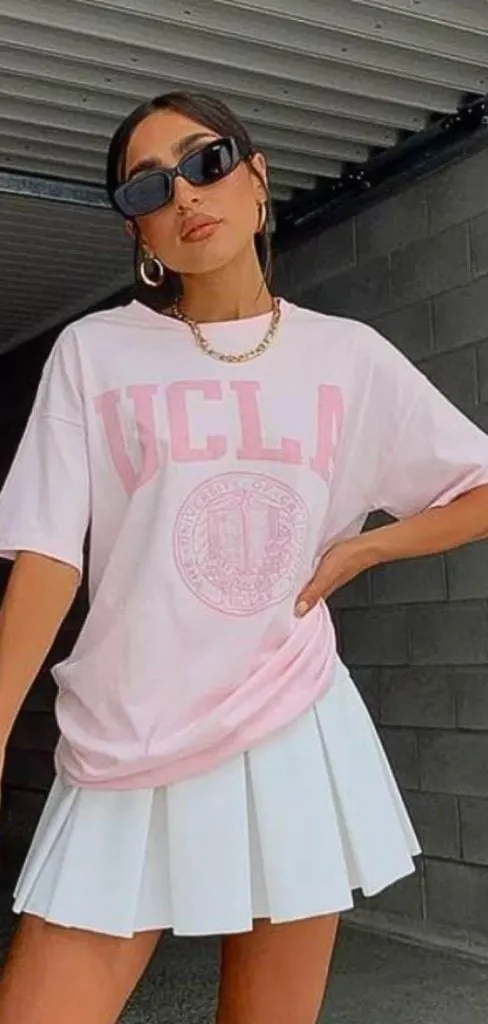 oversized tee , white pleated skirt 