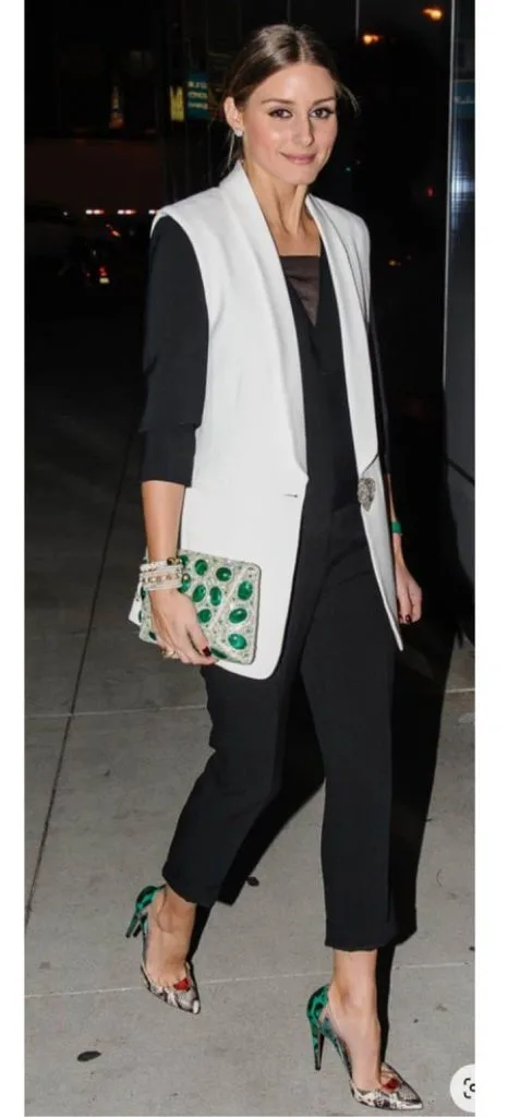 white sleeveless blazer and black dress