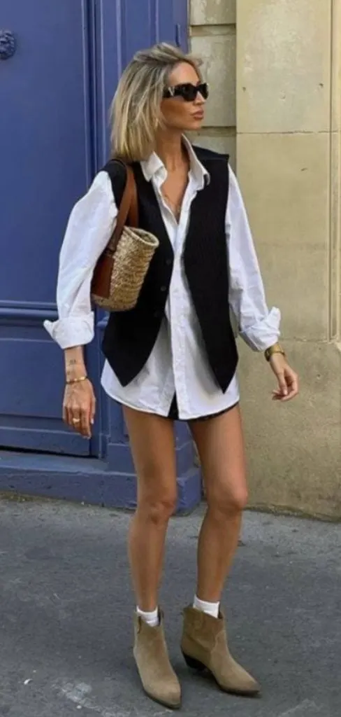 black waistcoat and cowboy boots