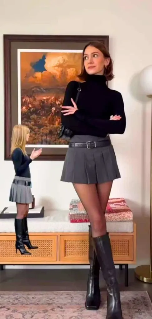 black turtleneck and grey pleated skirt outfit