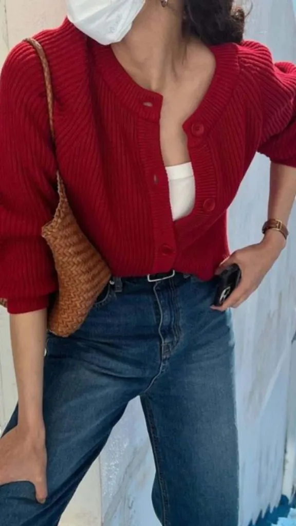 Tuck the cardigan with the jeans