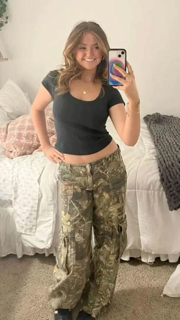 black tee and camo pants