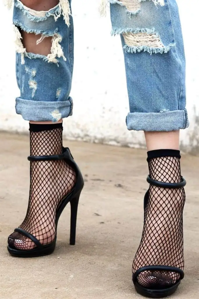 black fishnet socks and heels
