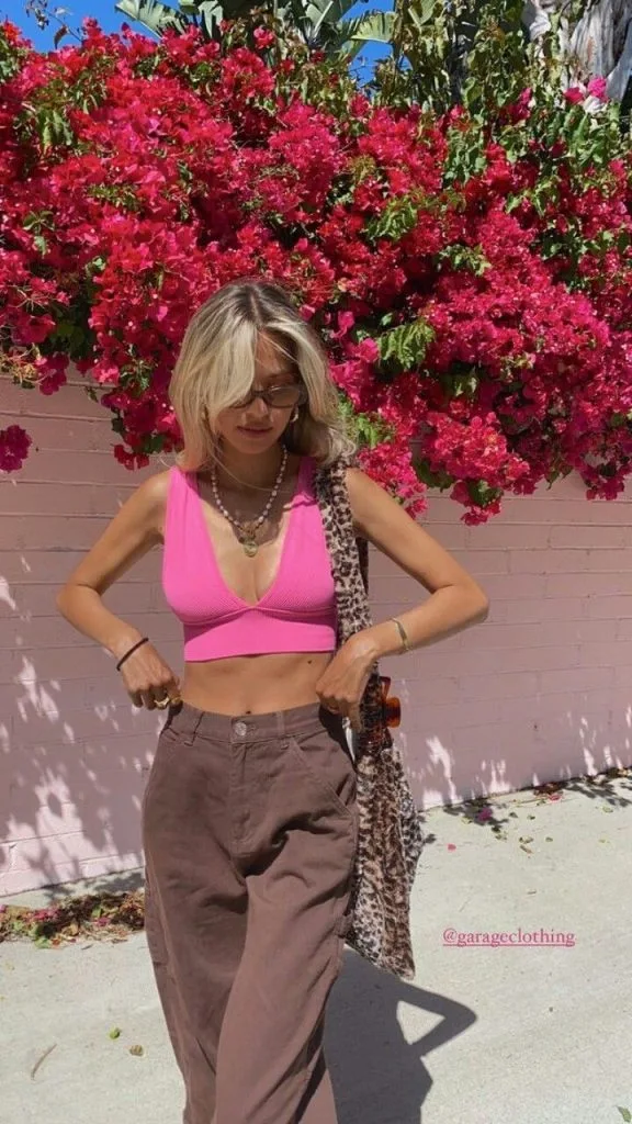 pink top and brown pants