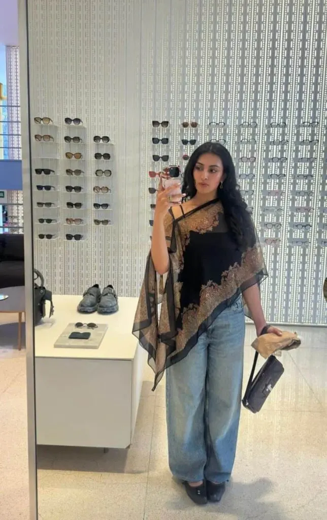 casual bollywood party outfit ideas with jeans assymmetrical poncho