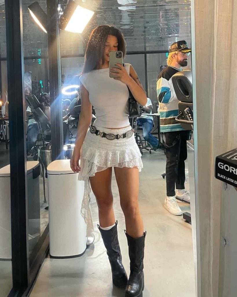  a ruffle skirt and boots outfit